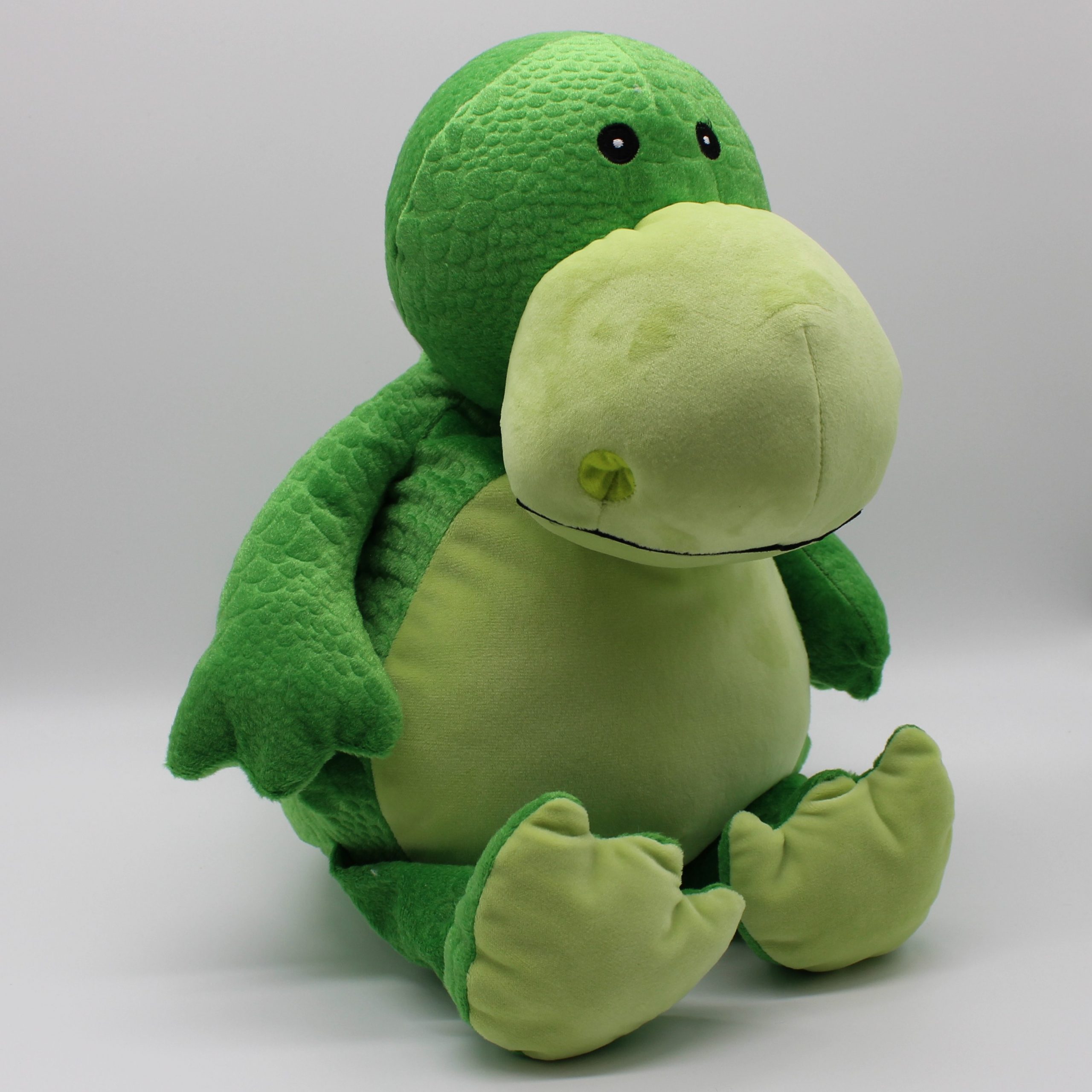 Grüner Kuscheltier Dino seitlich