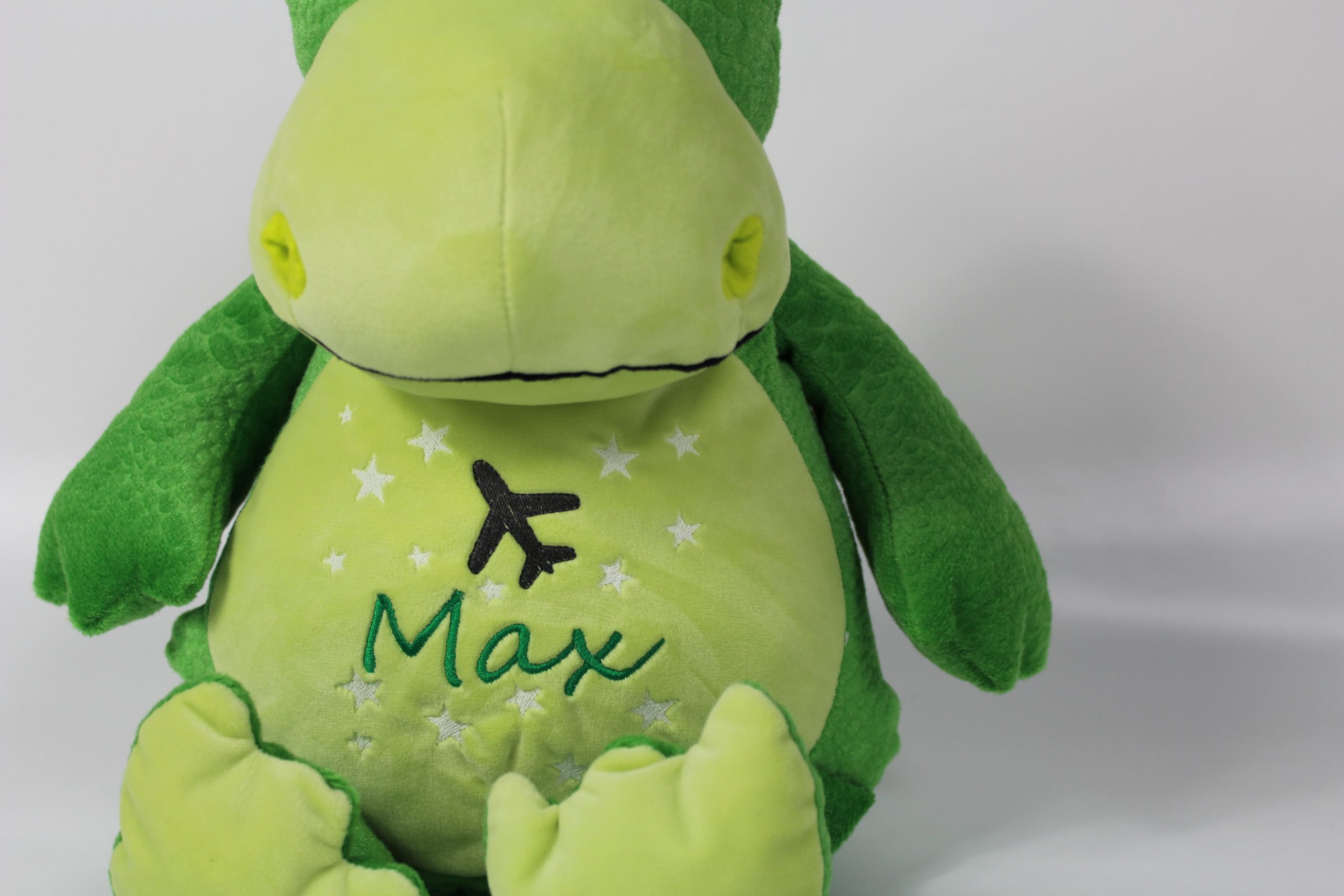 Grüner Kuscheltier Dino Bestickung