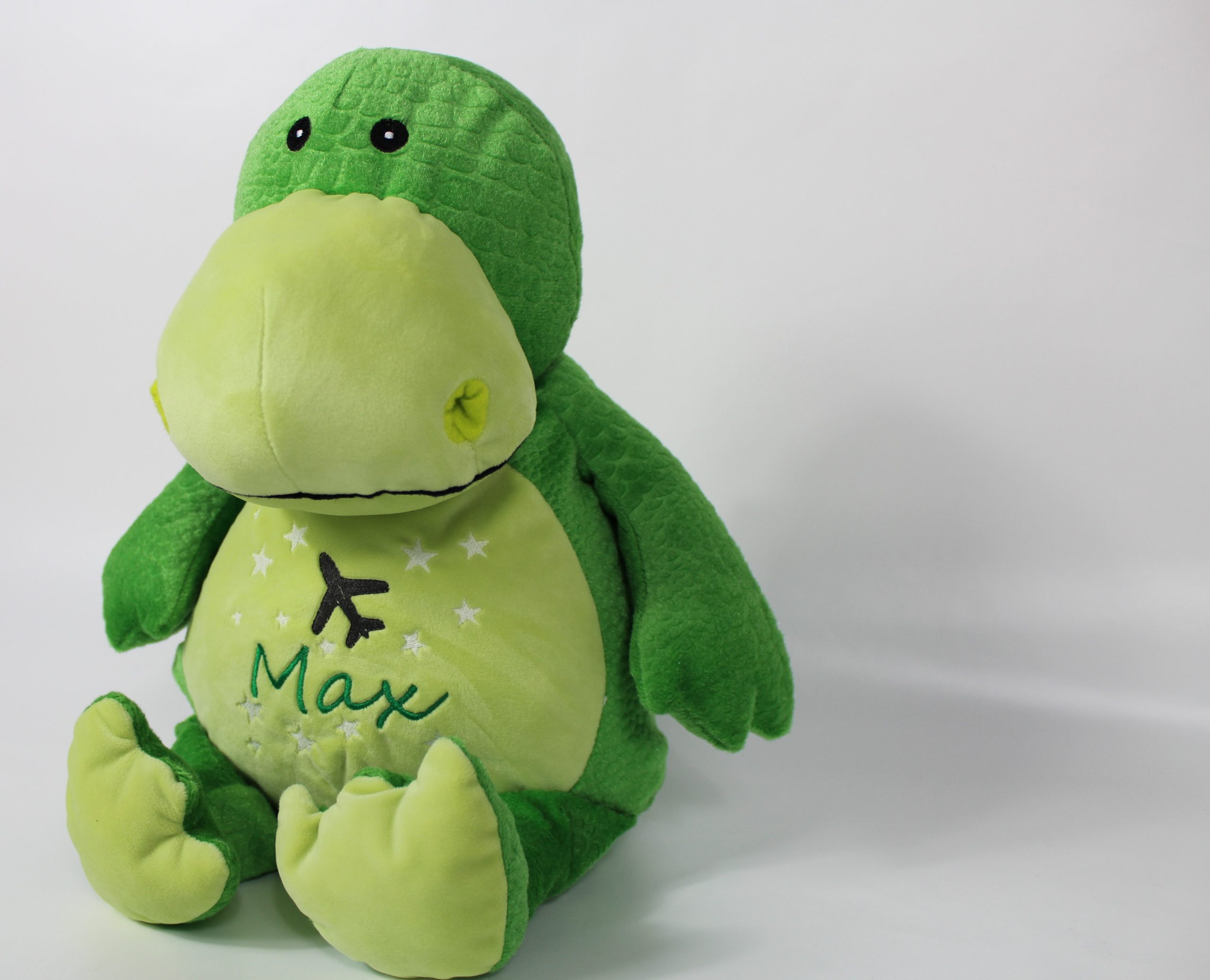 Grüner Kuscheltier Dino Bestickung seitlich